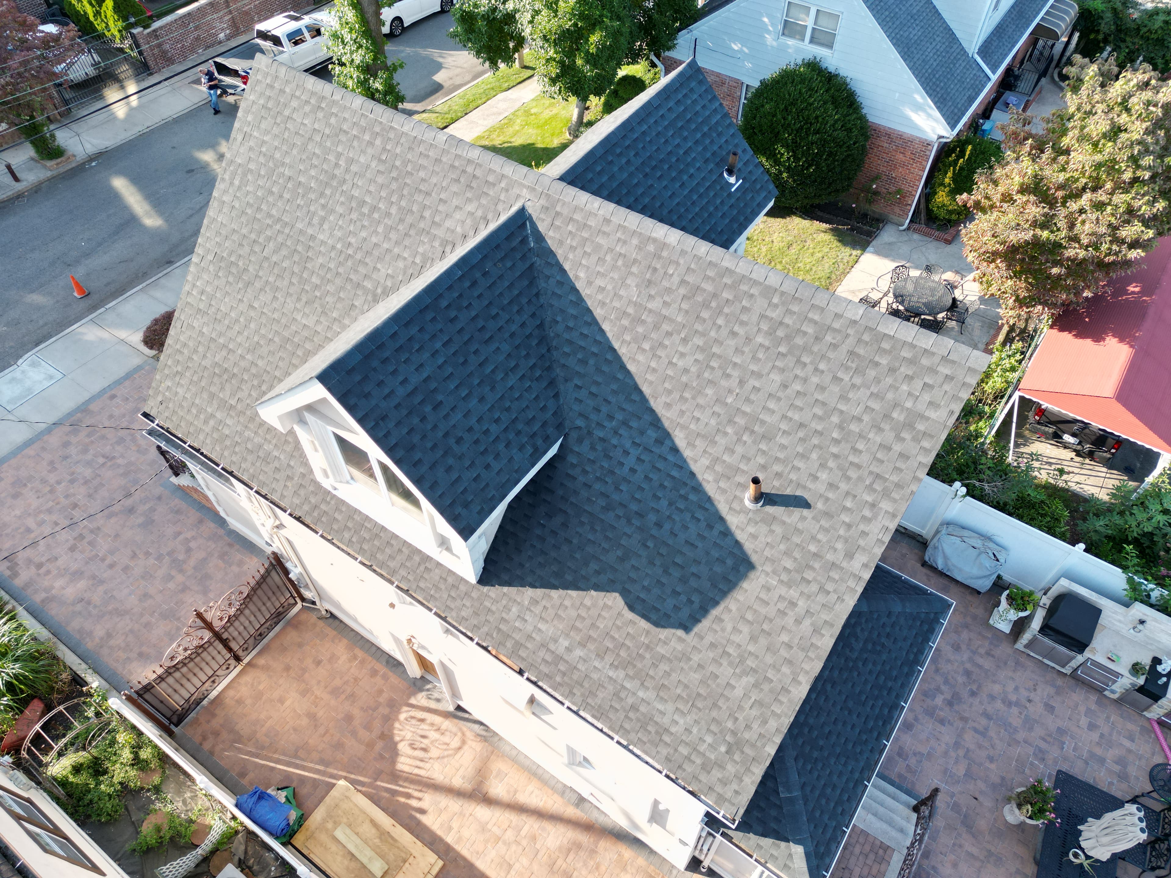 Lucky Stars Roofing crew performing roof replacement on a home in the Queens and Long Island area